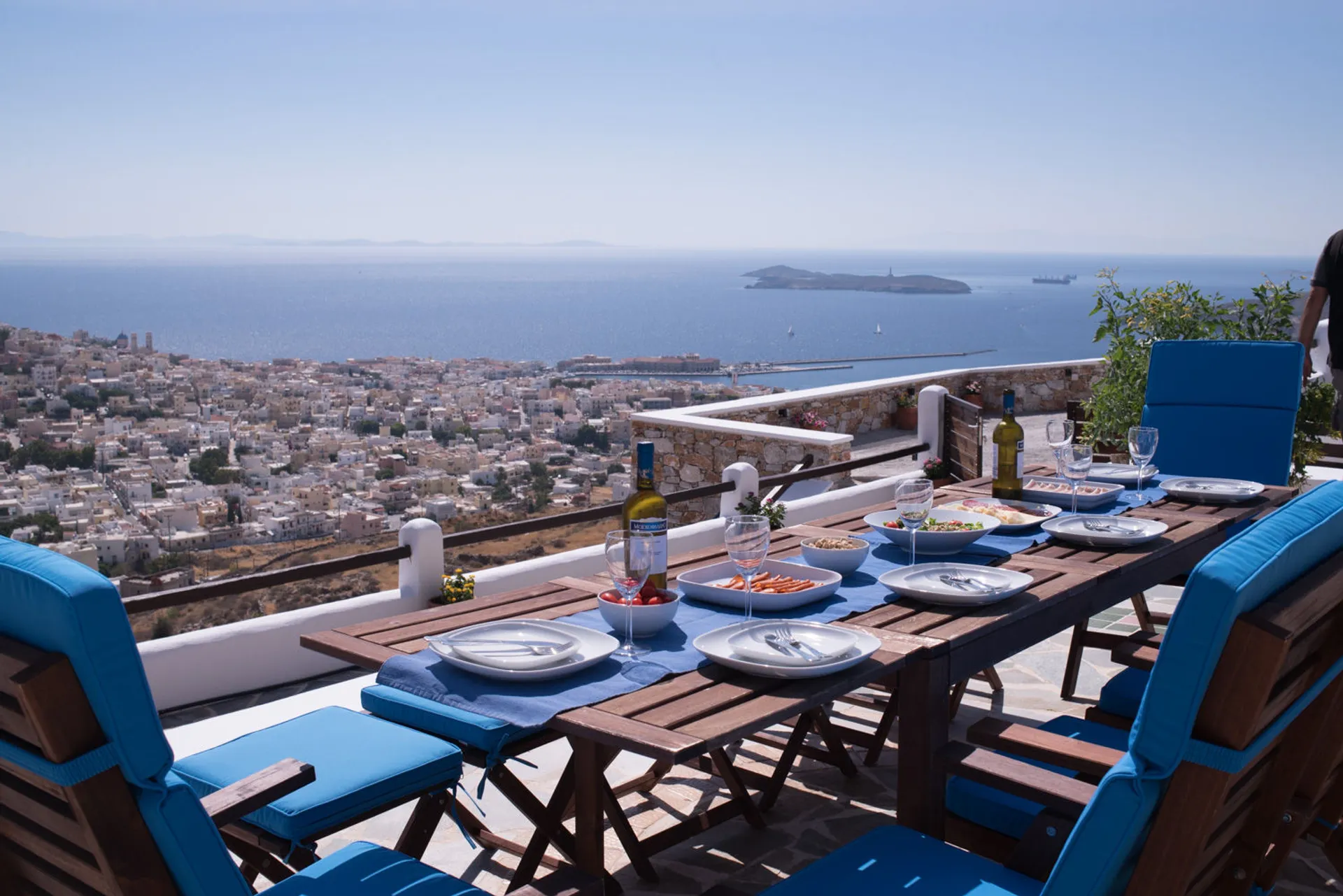 Luxury outdoor dining area with panoramic Aegean Sea view at Ermoupolis Panorama Art Villa